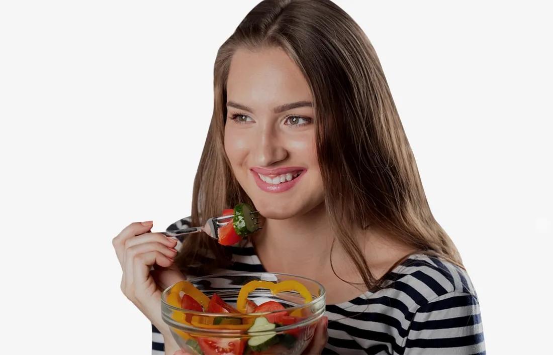 A girl eating a Balanced diet
