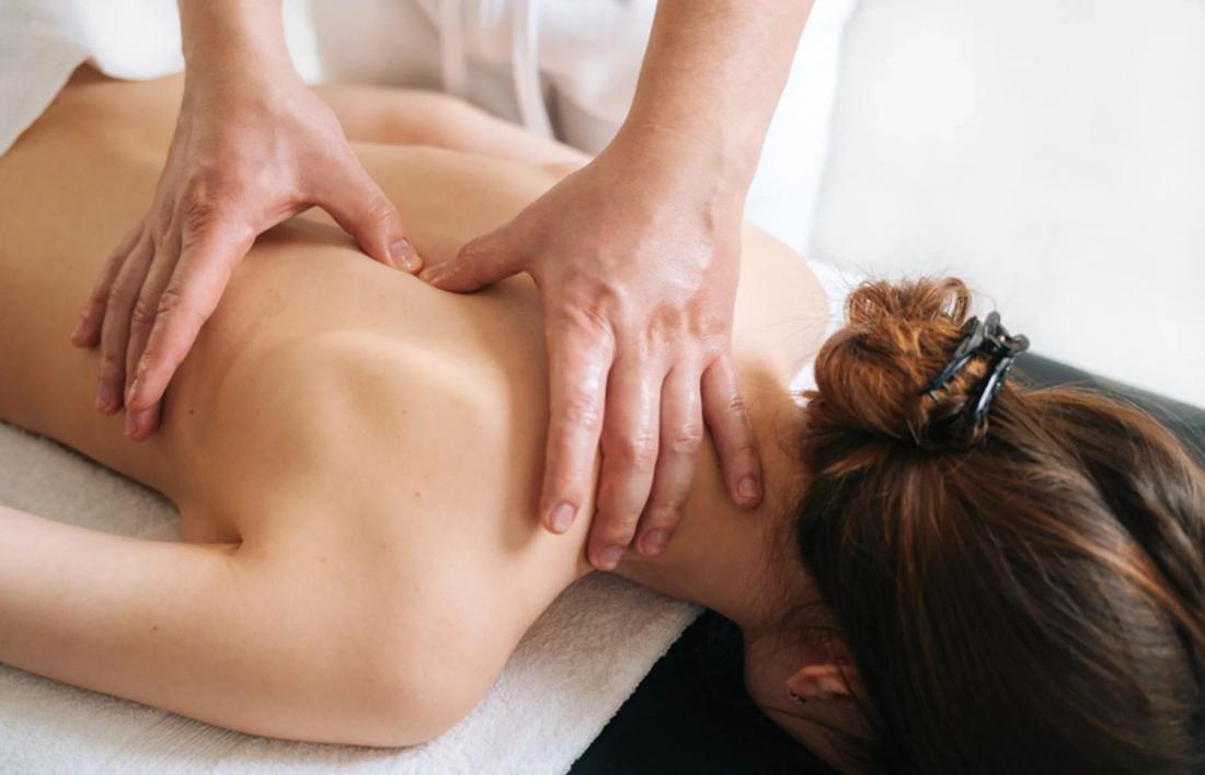A woman getting a massage on her back