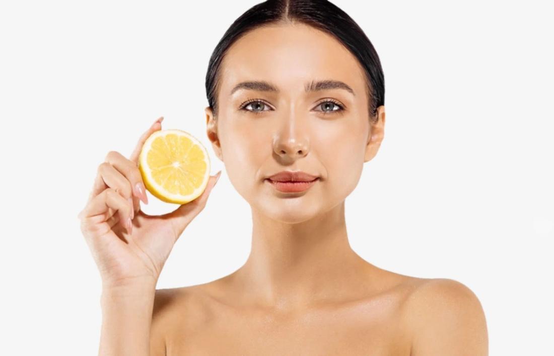 A woman holding a lemon in hand for targeted treatments