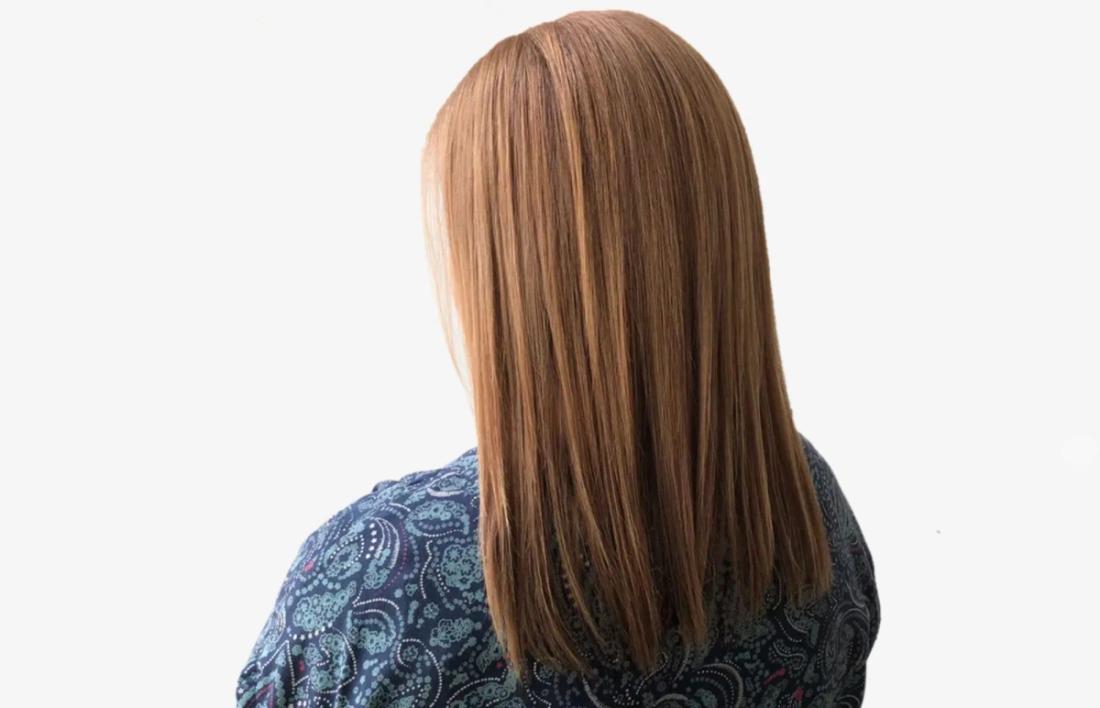 Backside photo of a women with rebonded hairs 